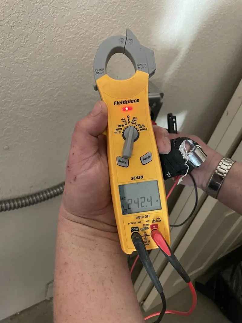 Voltage testing with clamp meter during Whole House Surge Protector in Pine
